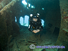 rebreather diver inside the hole on cricket wreck