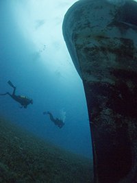 costandis wreck in limassol with divers swimming around the bow
