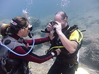 Diver completes mask skills under the watchful eye of PADI Instructor